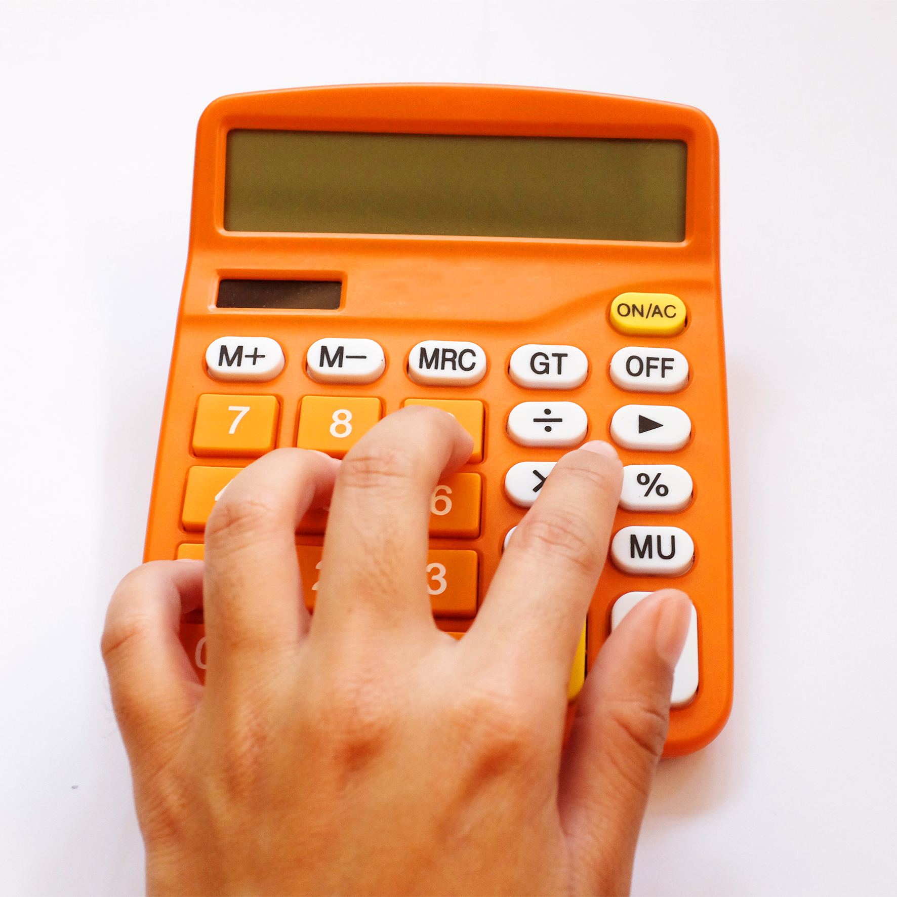cropped hand person using calculator white background