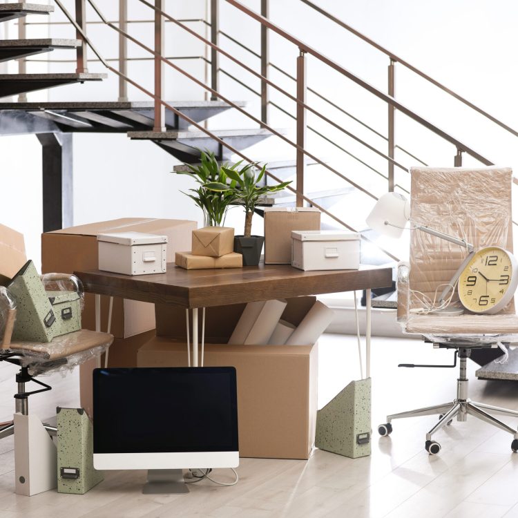 moving boxes and furniture in new office