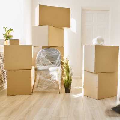 person moving fast among plenty of boxes